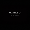Black background with white text 'MARKED NOT YET REVEALED'