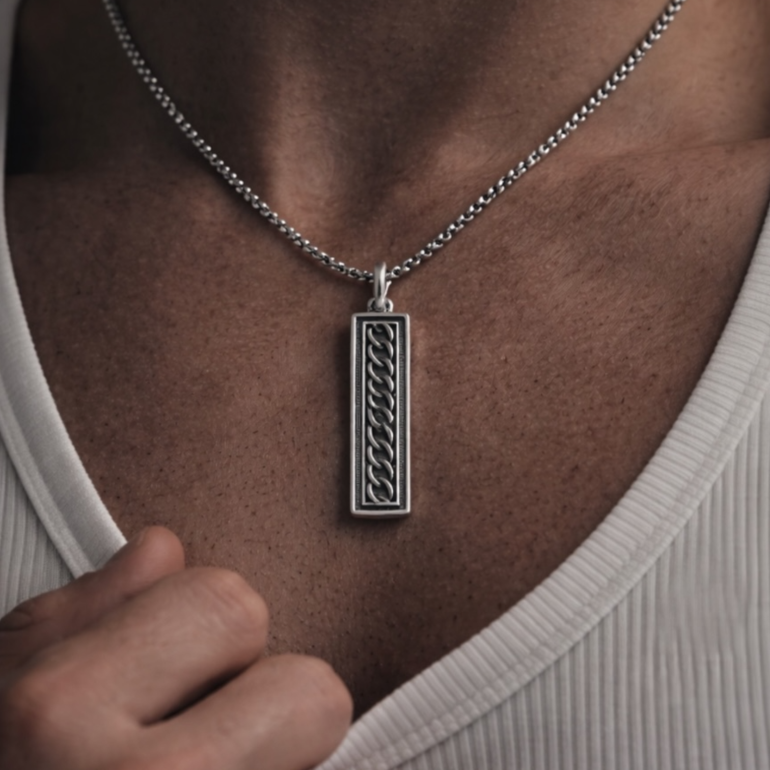 Sterling silver ingot pendant on micro belcher chain worn on chest, UNMARKED jewellery